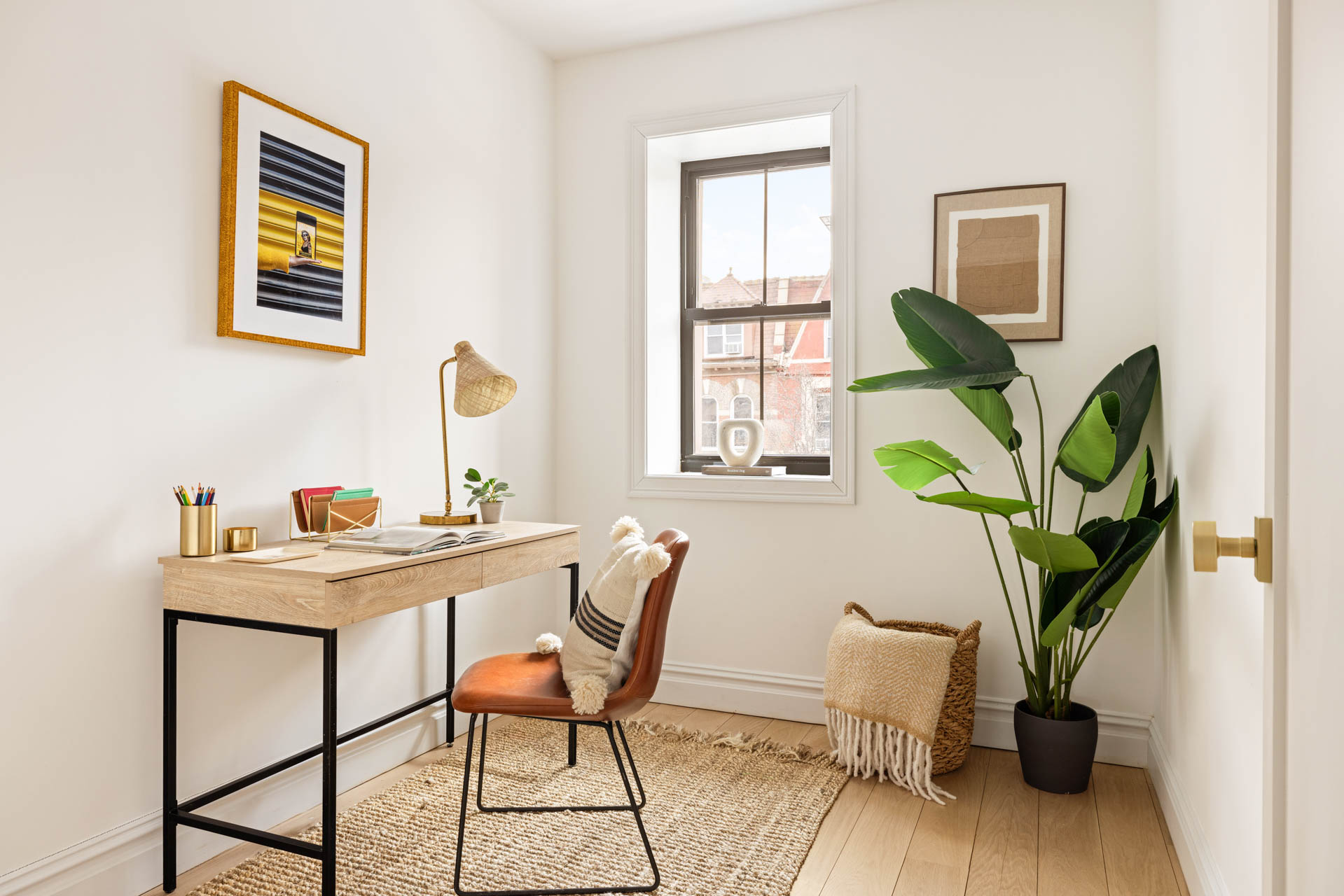 819 Greene Avenue Brooklyn, NY 11221 - Photo 12 of 14 a view of a workspace with furniture and a potted plant
