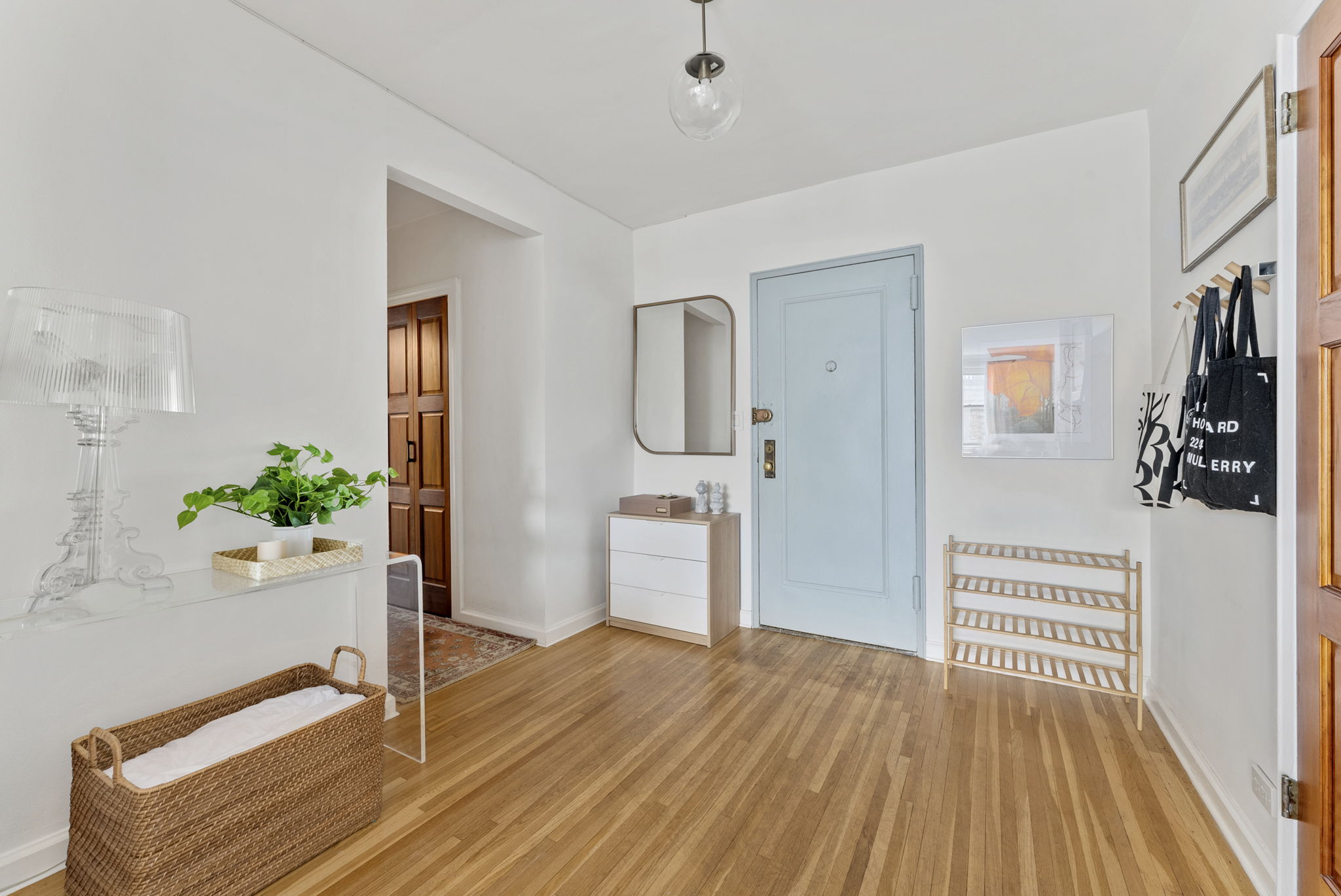 675 Academy Street, Unit 5E Manhattan, NY 10034 - Photo 6 of 10 a view of a hallway view with wooden floor and staircase