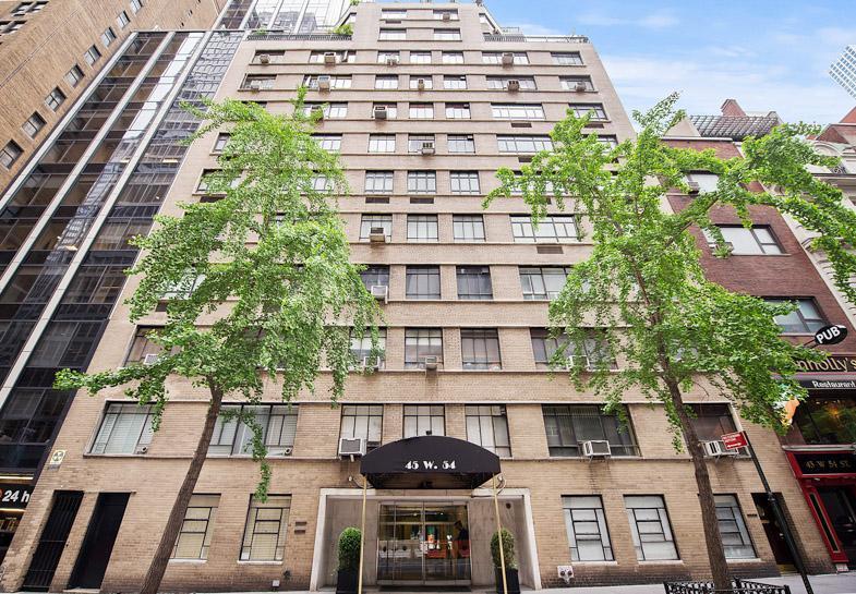 45 West 54th Street, Unit 10A Manhattan, NY 10019 - Photo 9 of 10 a front view of a multi story building