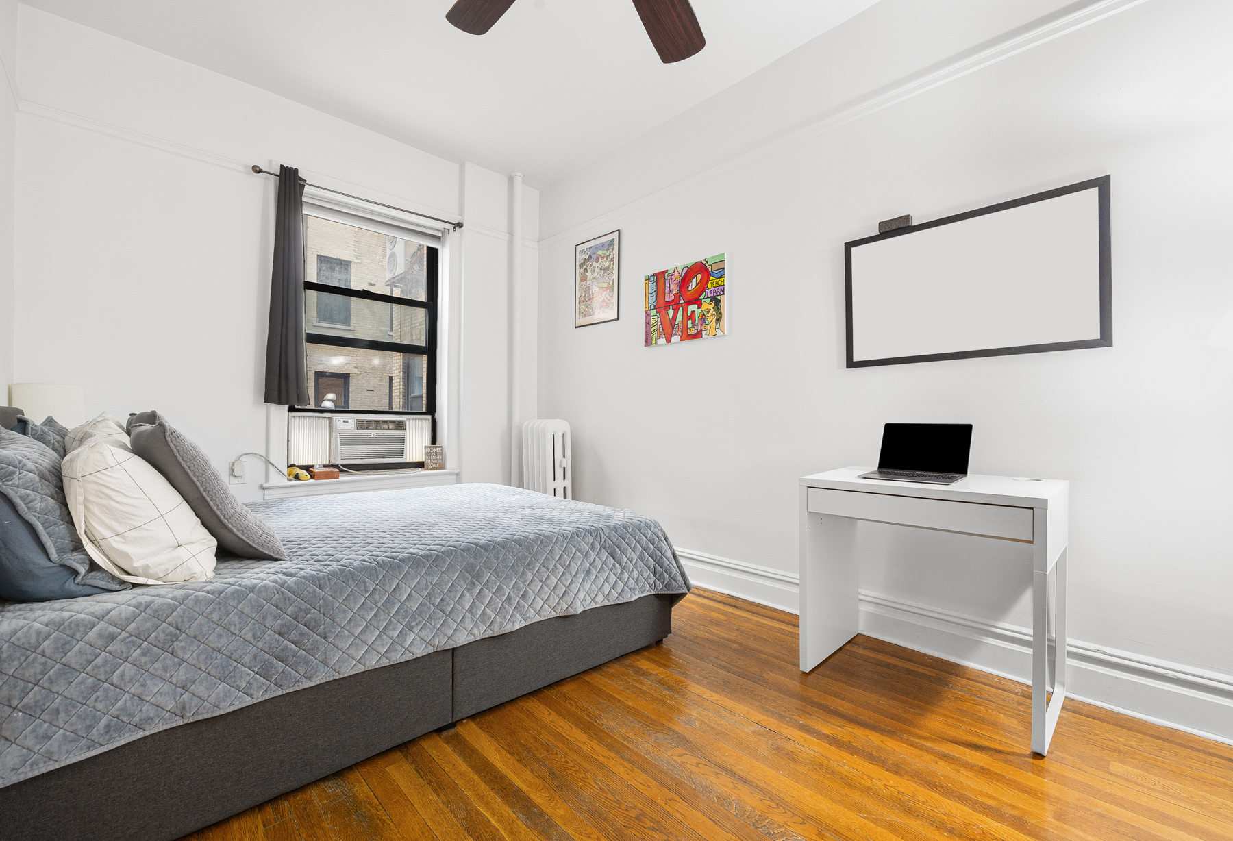 255 Eastern Parkway, Unit C5 Brooklyn, NY 11238 - Photo 7 of 9 a bedroom with a bed and a flat screen tv