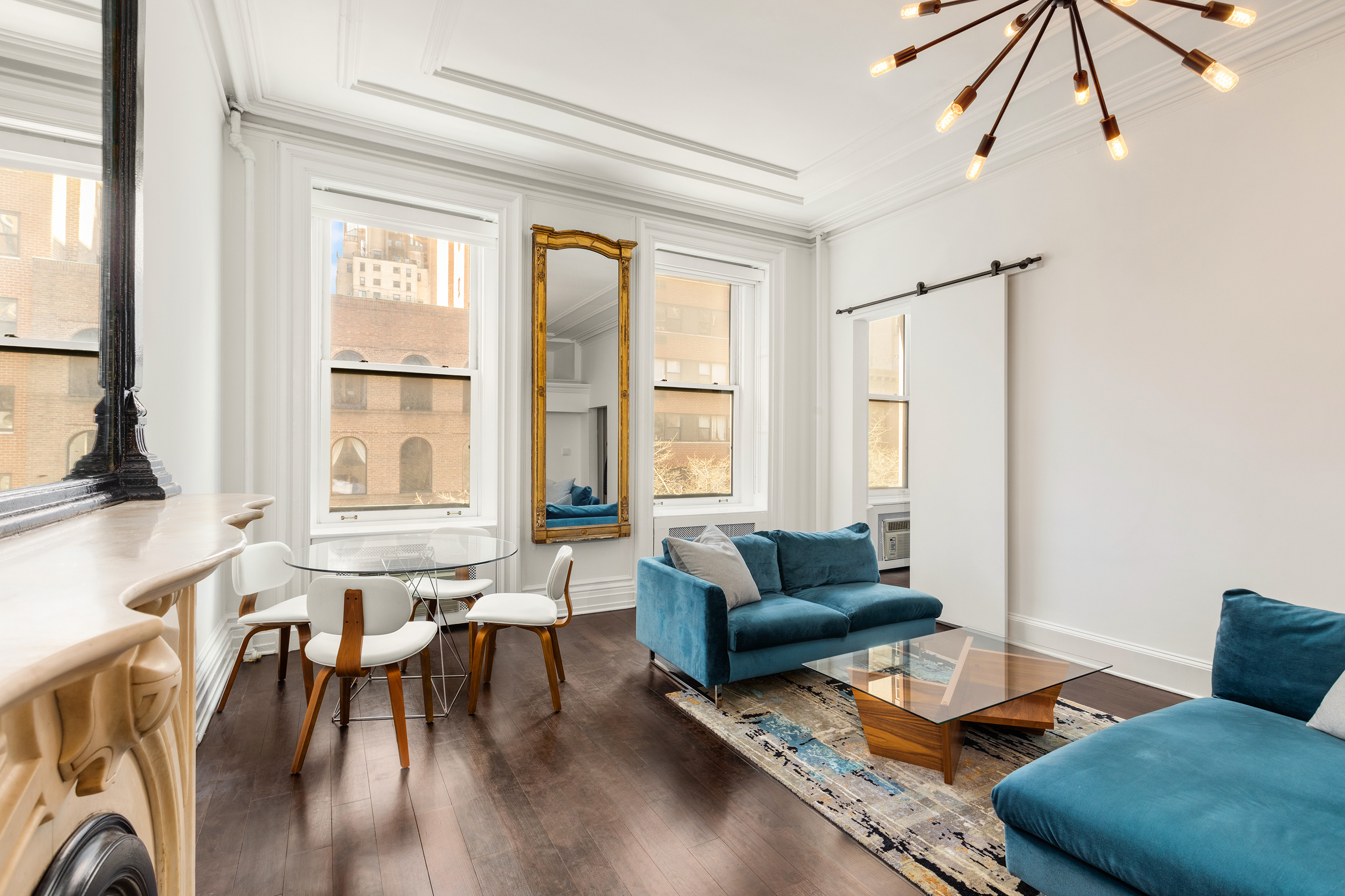 111 East 36th Street, Unit 4A Manhattan, NY 10016 - Photo 3 of 19 a living room with furniture and a large window