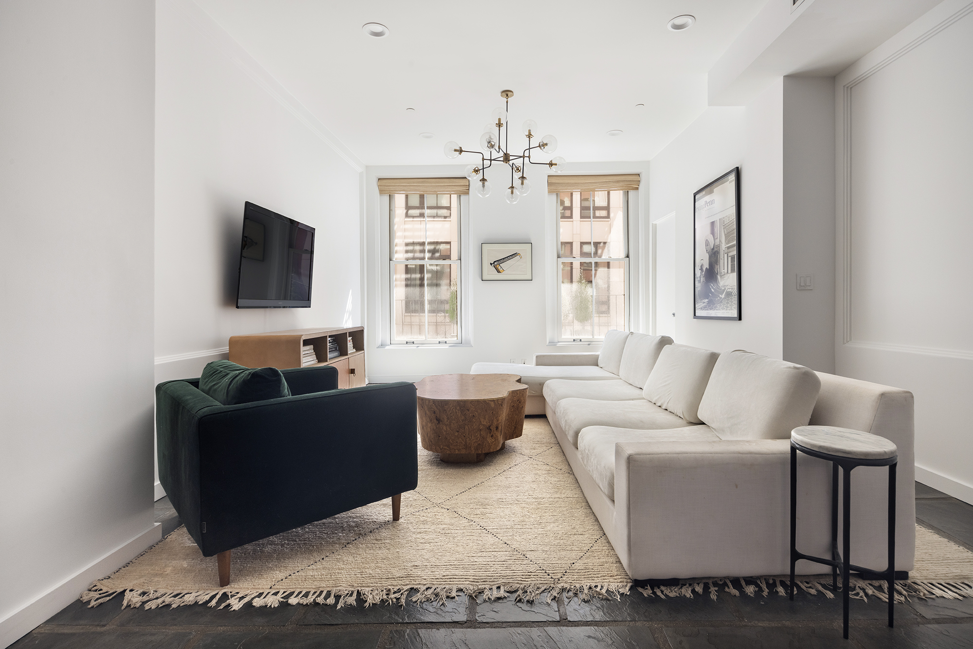 25 Leonard Street, Unit 2 New York, NY 10013 - Photo 2 of 12 a living room with furniture and a flat screen tv