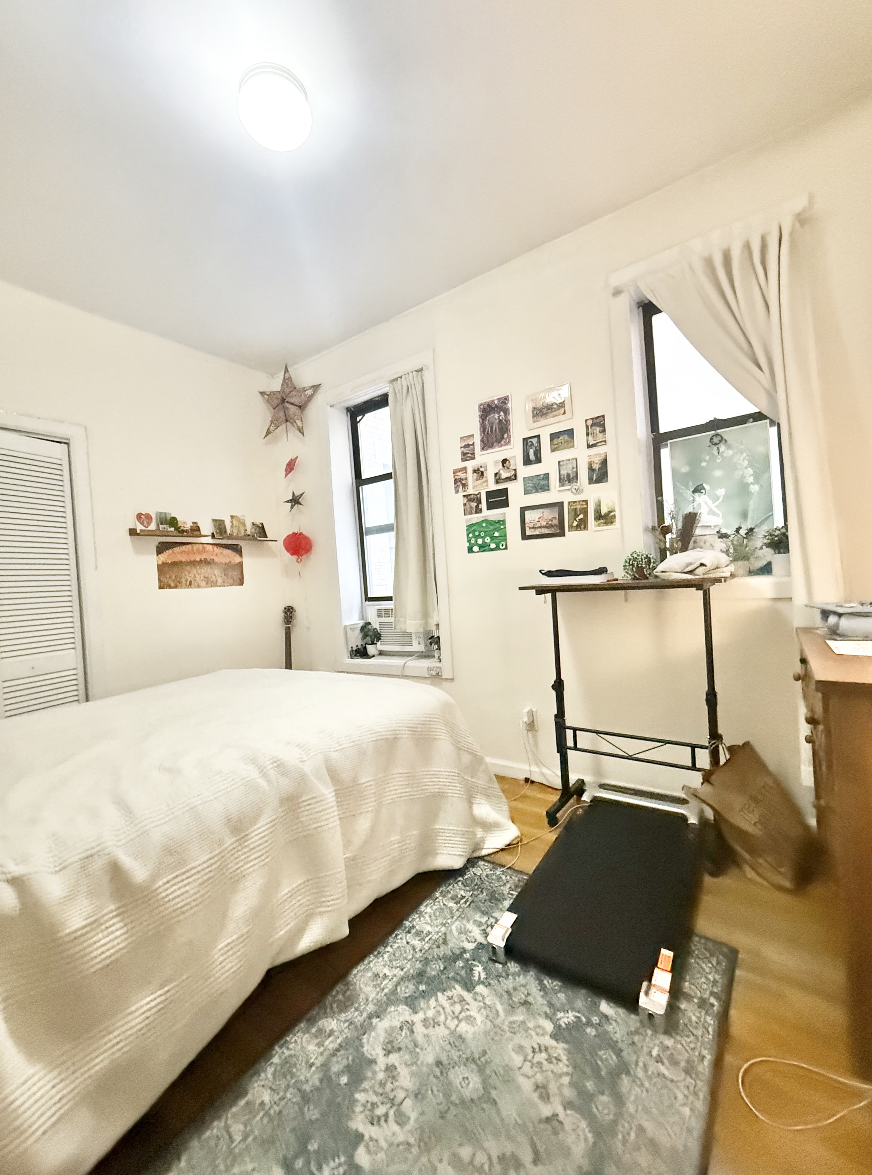 205 West 103rd Street, Unit 3A Manhattan, NY 10025 - Photo 5 of 9 a bedroom with a bed and window