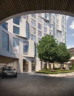 a view of a street that has couple of cars parked on the road