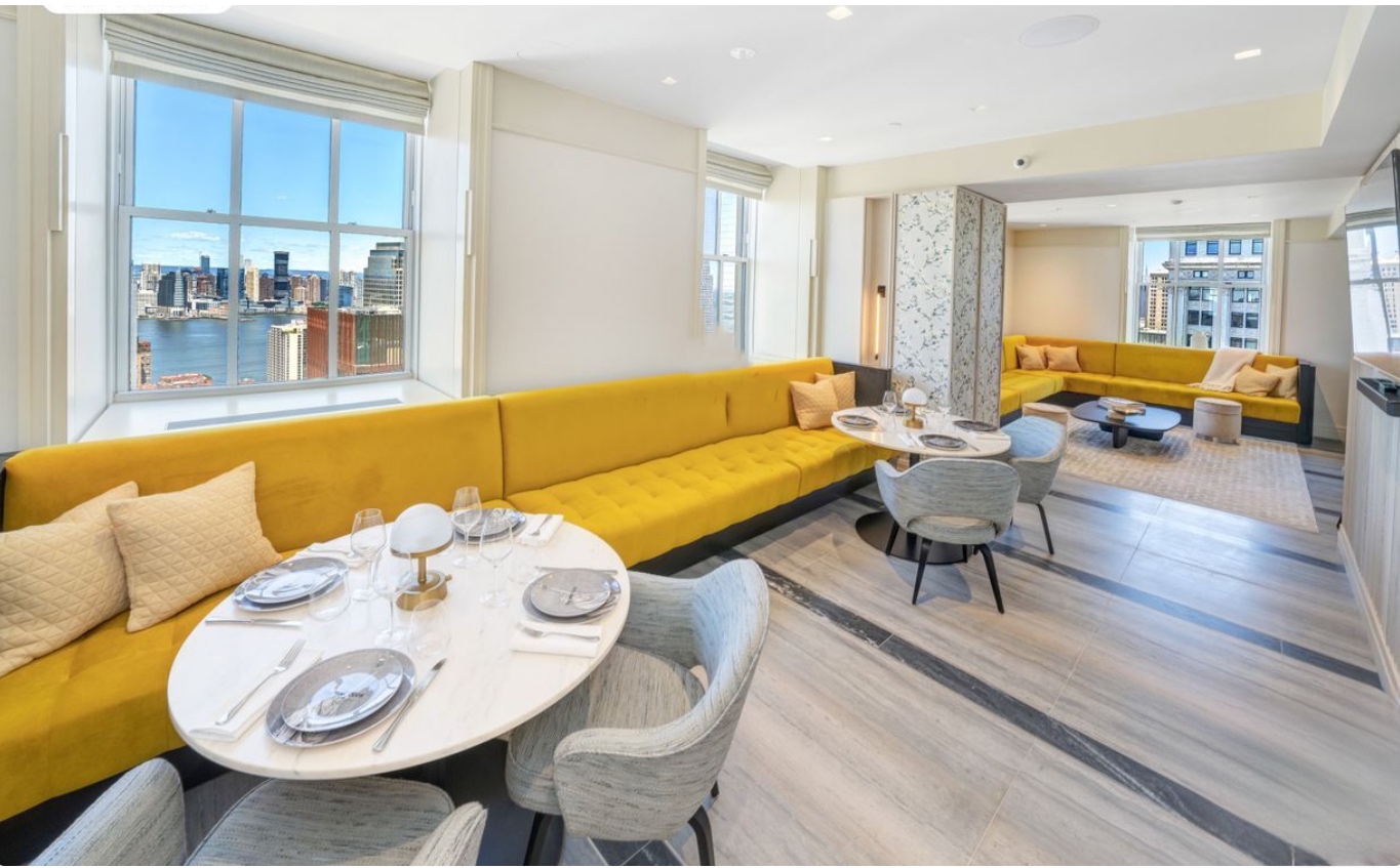 1 Wall Street, Unit 2512 Manhattan, NY 10005 - Photo 20 of 31 a living room with furniture and wooden floor
