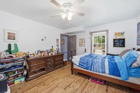 a living room with furniture and a dresser