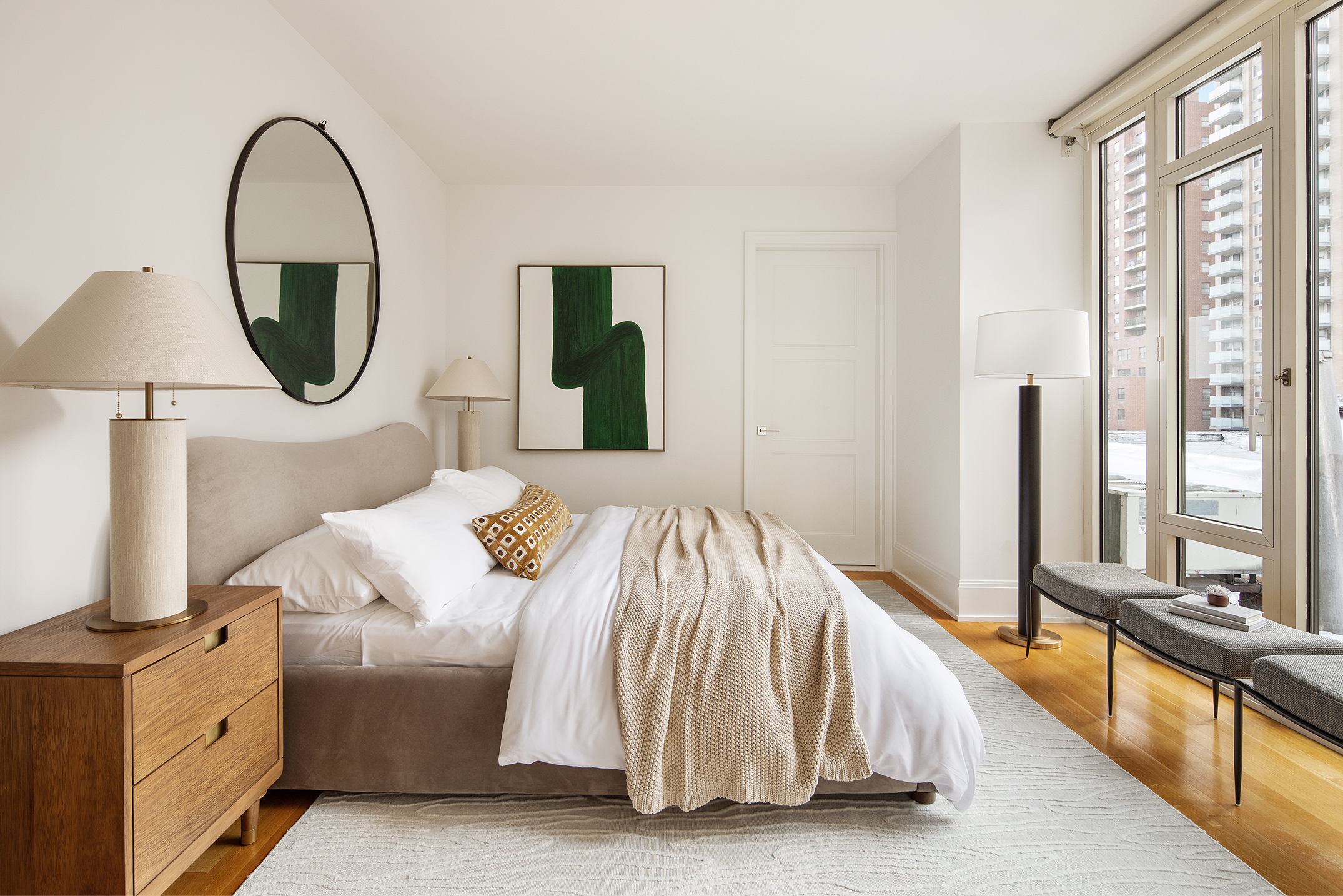 305 East 85th Street, Unit 5B Manhattan, NY 10028 - Photo 7 of 11 a spacious bedroom with a bed and a large window