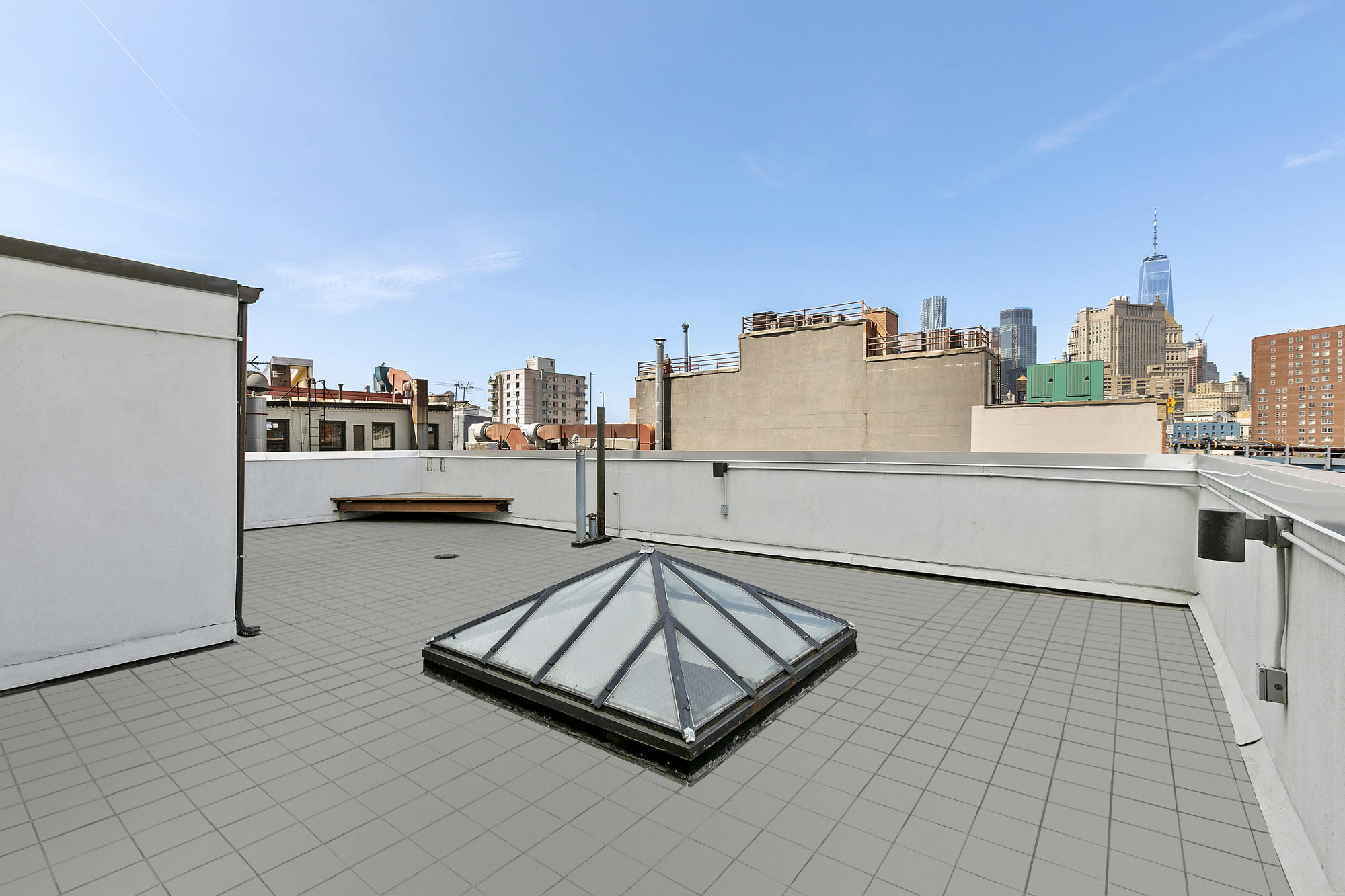 85 Division Street, Unit 4 Manhattan, NY 10002 - Photo 10 of 22 a living room with furniture and a table