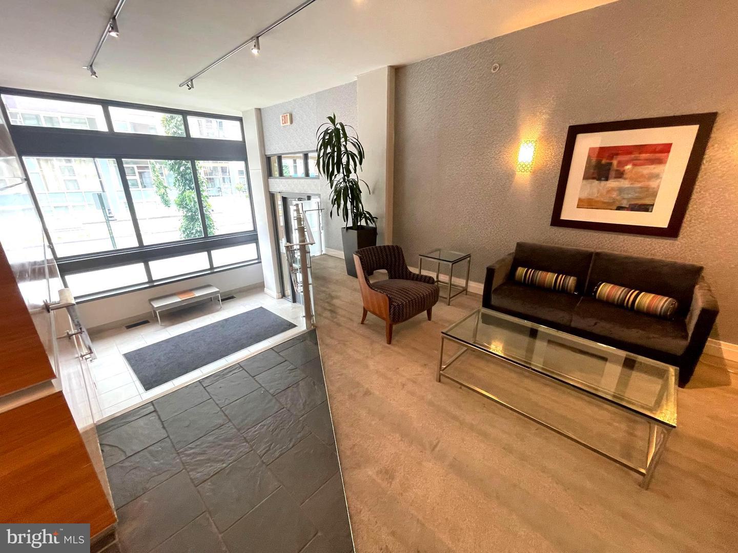 2120 Vermont Avenue Northwest, Unit 620 Washington, DC 20001 - Photo 27 of 61 a living room with furniture and a window