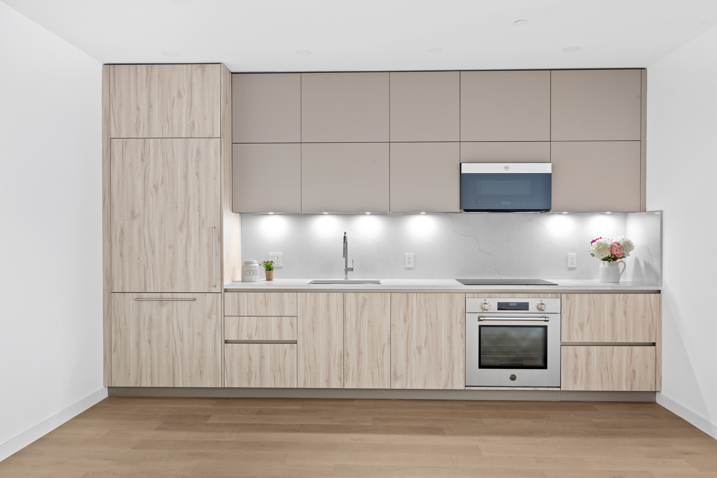 249 18th Street, Unit 1 Brooklyn, NY 11215 - Photo 3 of 12 a kitchen with white cabinets and sink