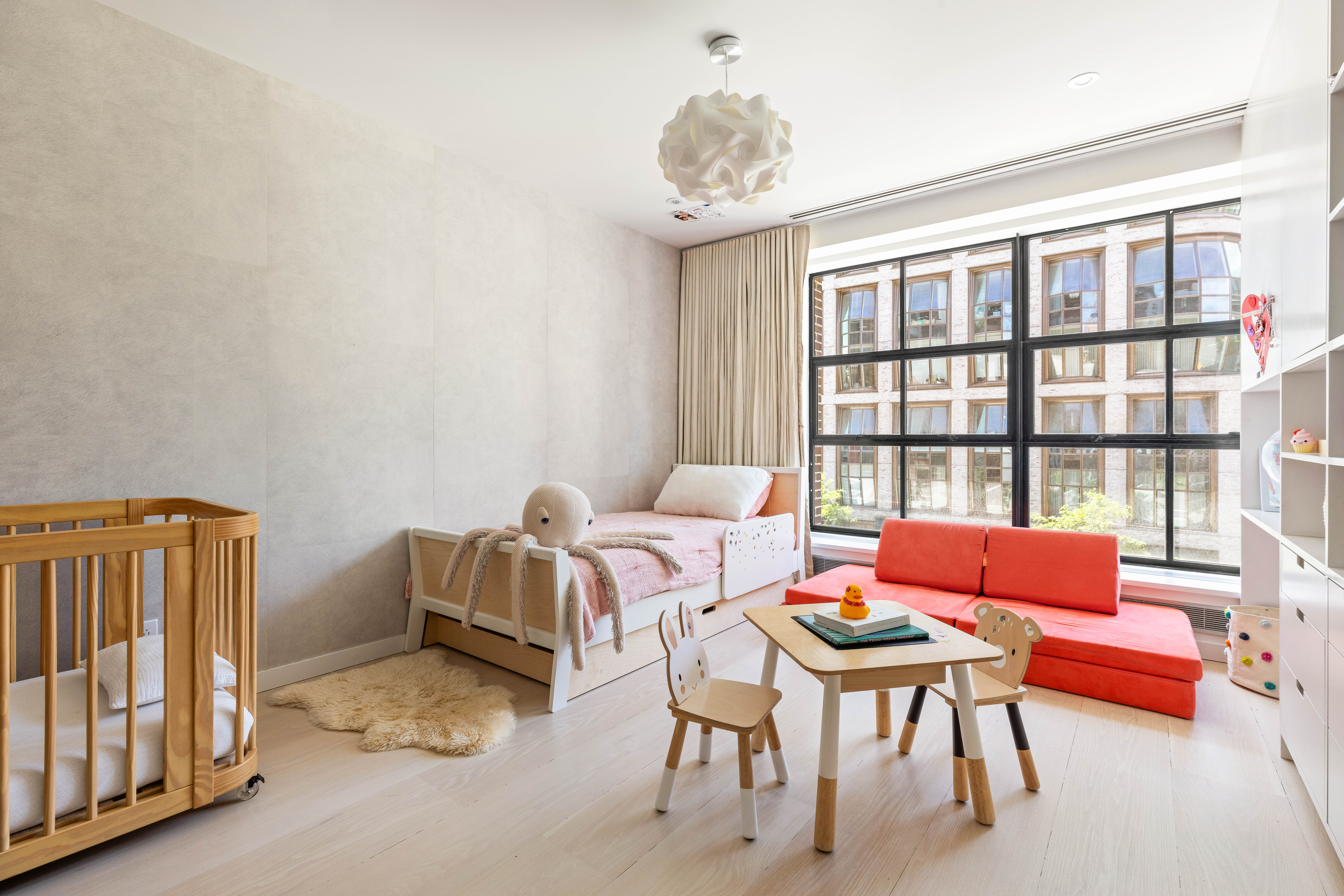 456 West 19th Street, Unit 2/3F Manhattan, NY 10011 - Photo 9 of 14 a bedroom with furniture and a window