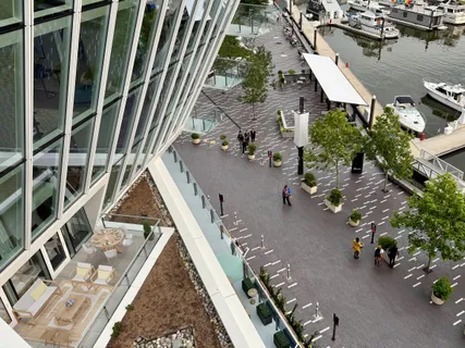 a bathroom with a granite countertop sink a toilet and a mirror