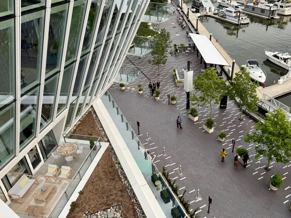 a bathroom with a granite countertop sink a toilet and a mirror