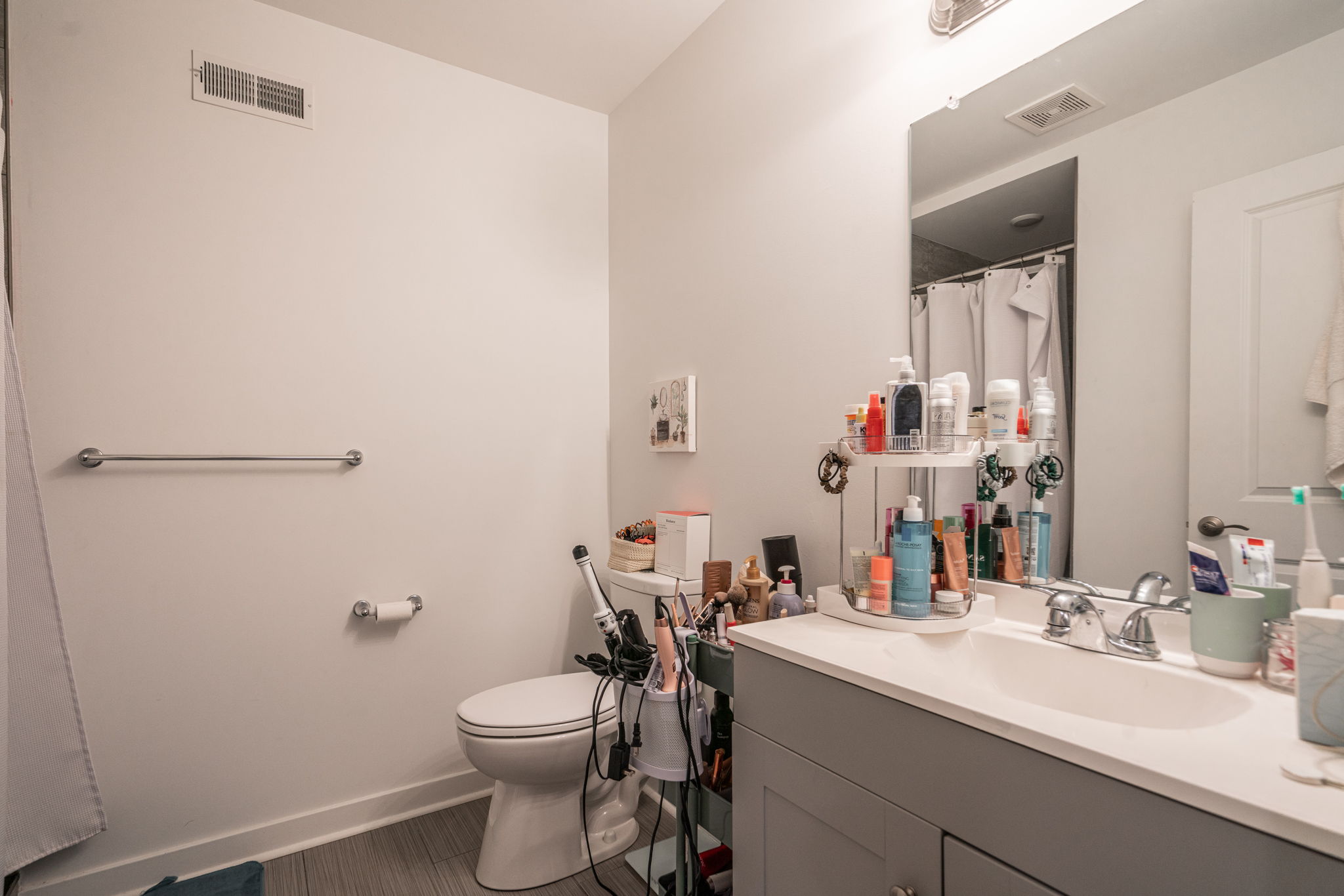2613 Federal Street, Unit B Philadelphia, PA 19146 - Photo 9 of 21 a bathroom with a sink a toilet and shower