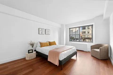 a bedroom with a bed and a couch