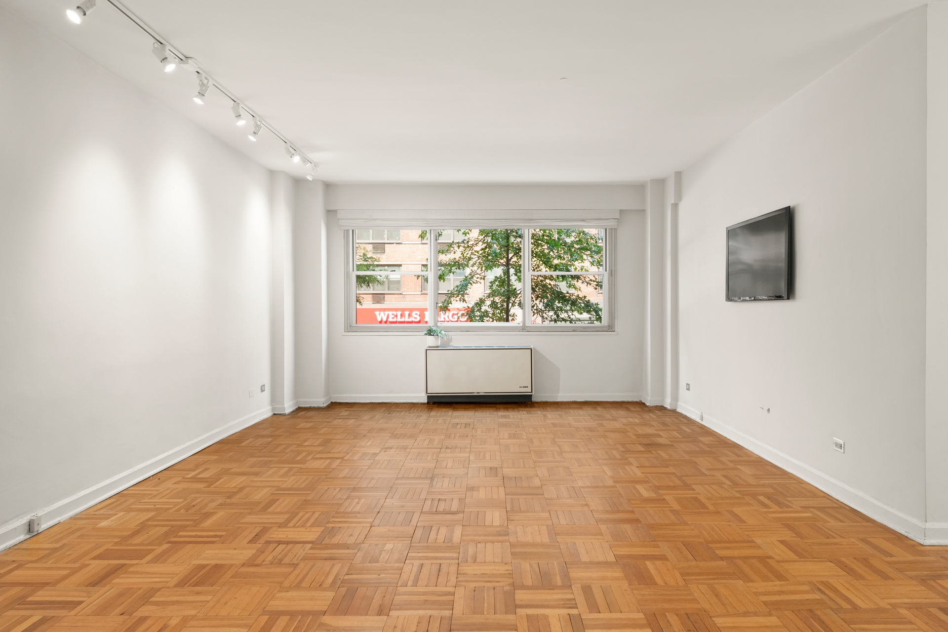 70 East 10th Street, Unit 2P Manhattan, NY 10003 - Photo 2 of 17 a view of an empty room with a window