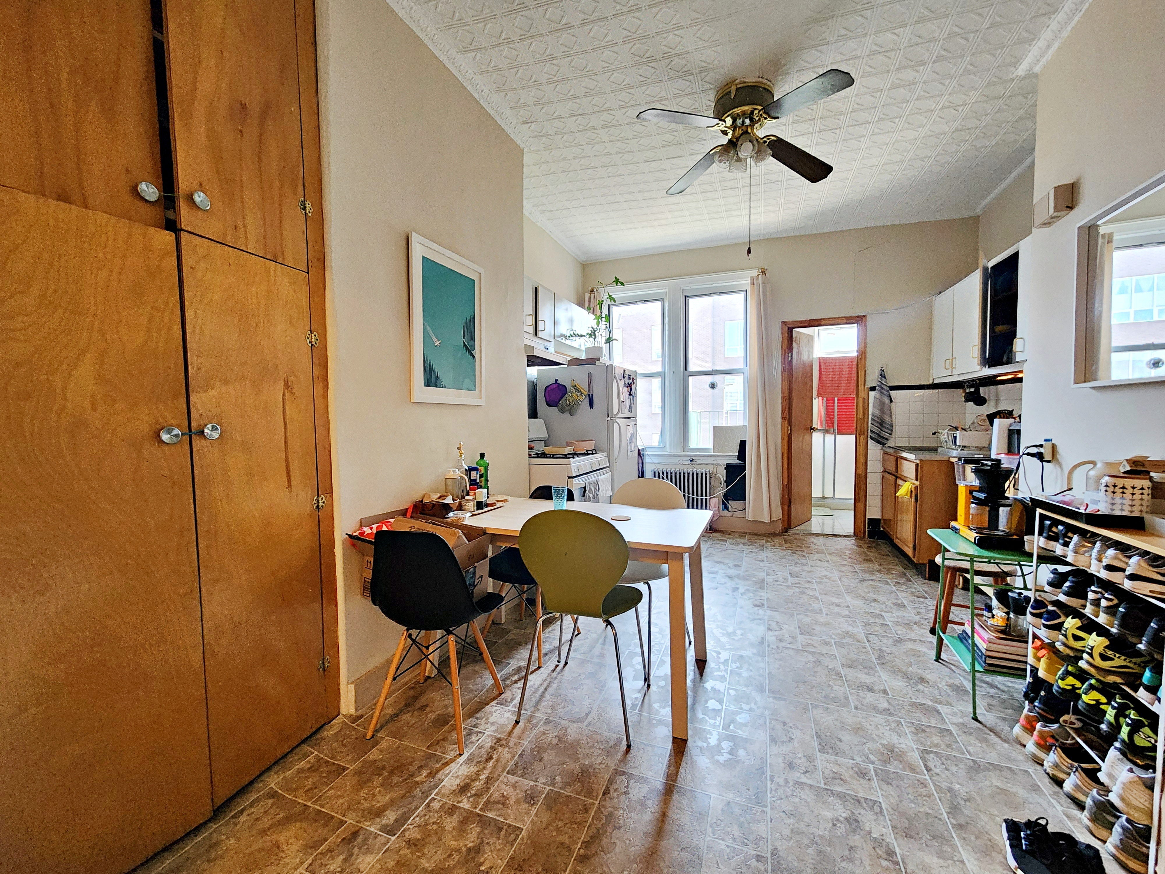 148 Withers Street, Unit 3L Brooklyn, NY 11211 - Photo 2 of 9 a living room with furniture and a chandelier