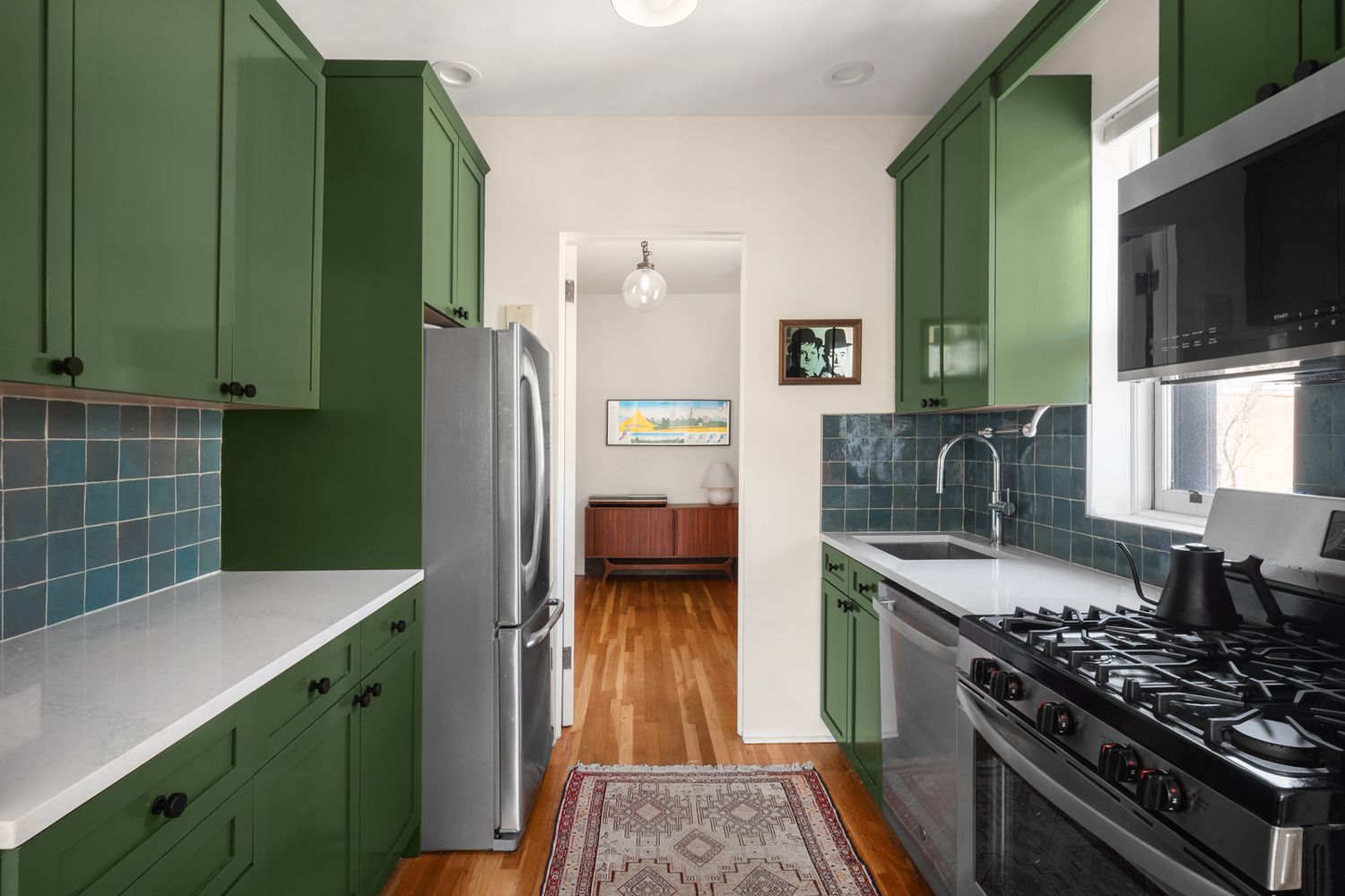 a kitchen with cabinets and a stove top oven