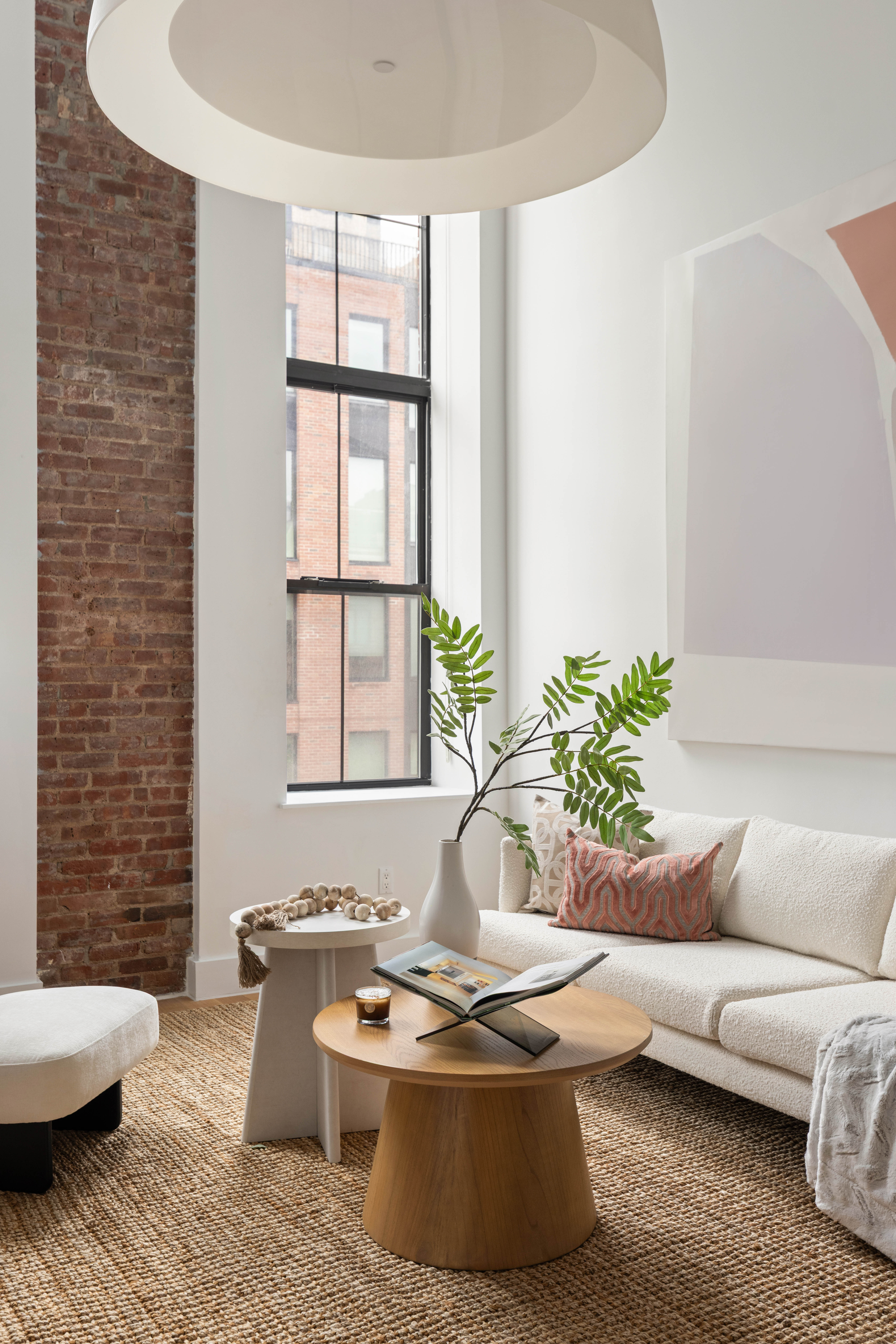 172 North 10th Street, Unit 3D Brooklyn, NY 11211 - Photo 2 of 16 a living room with furniture and a potted plant