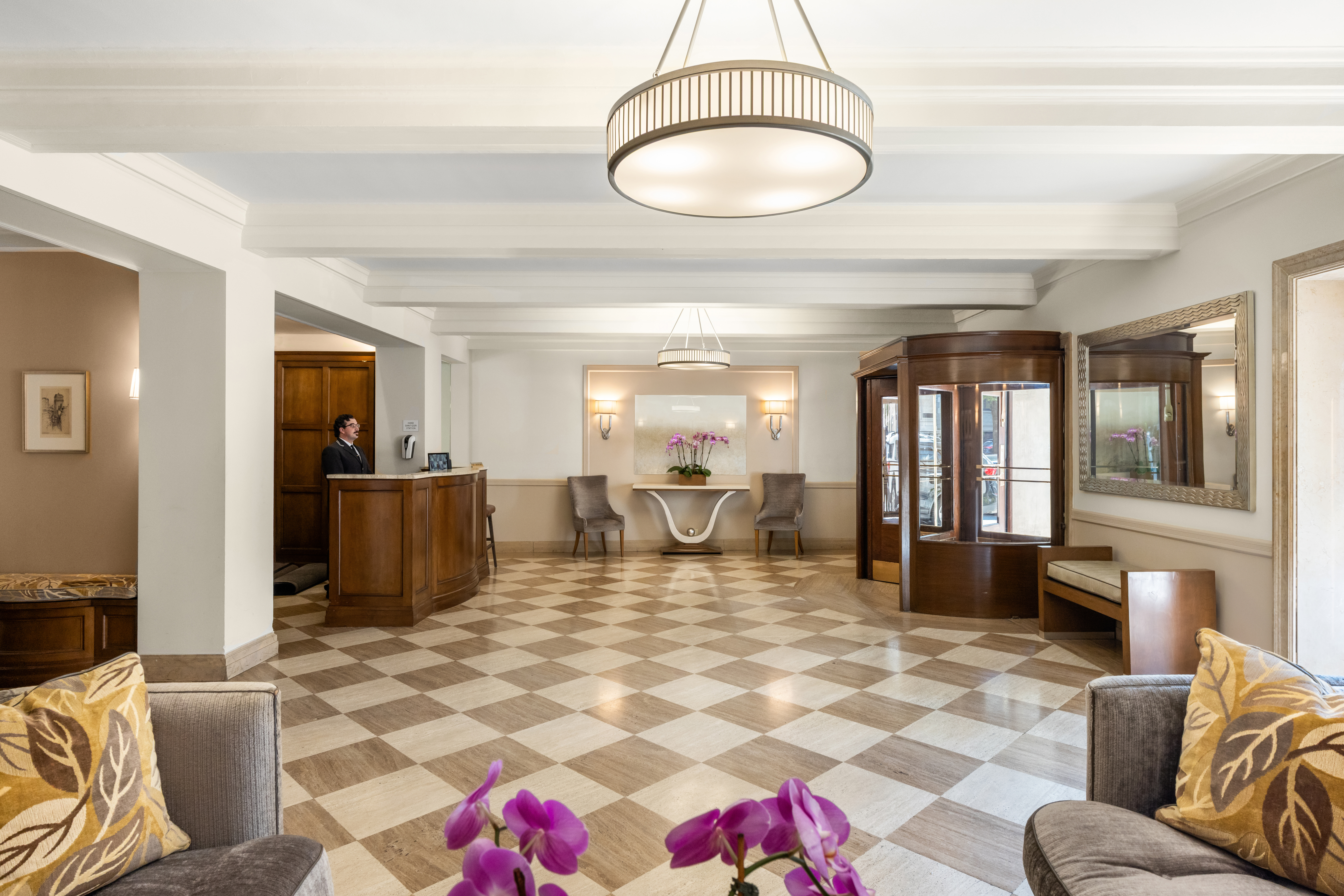 993 Park Avenue, Unit 4C Manhattan, NY 10028 - Photo 14 of 15 a living room with furniture and a flat screen tv