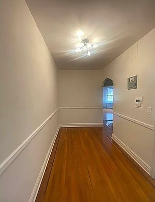 625 Caton Avenue, Unit 4E Brooklyn, NY 11218 - Photo 4 of 12 a view of a room with wooden floor and staircase