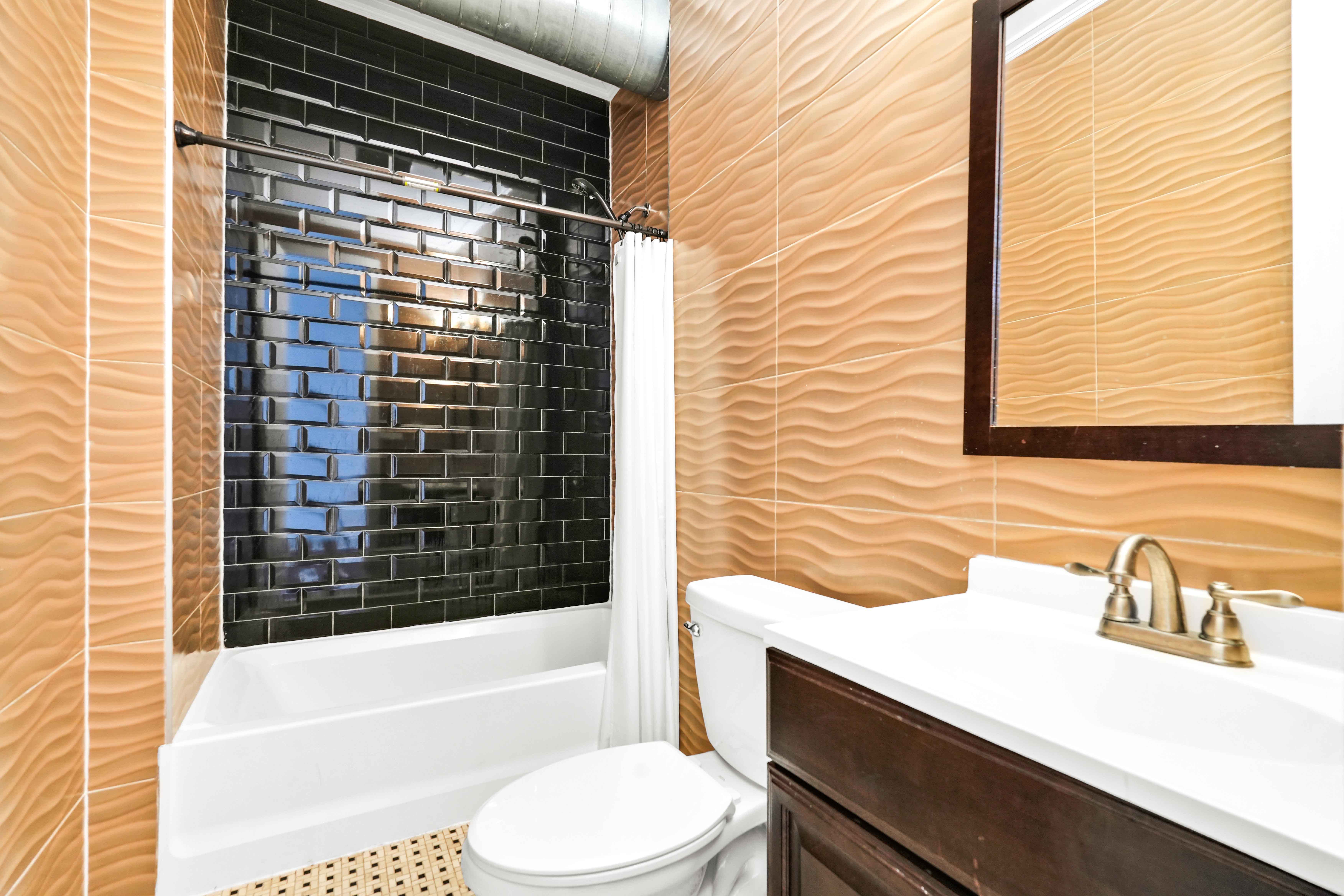 17 A Suydam Place, Unit 2 Brooklyn, NY 11233 - Photo 11 of 28 a bathroom with a sink a toilet and bathtub