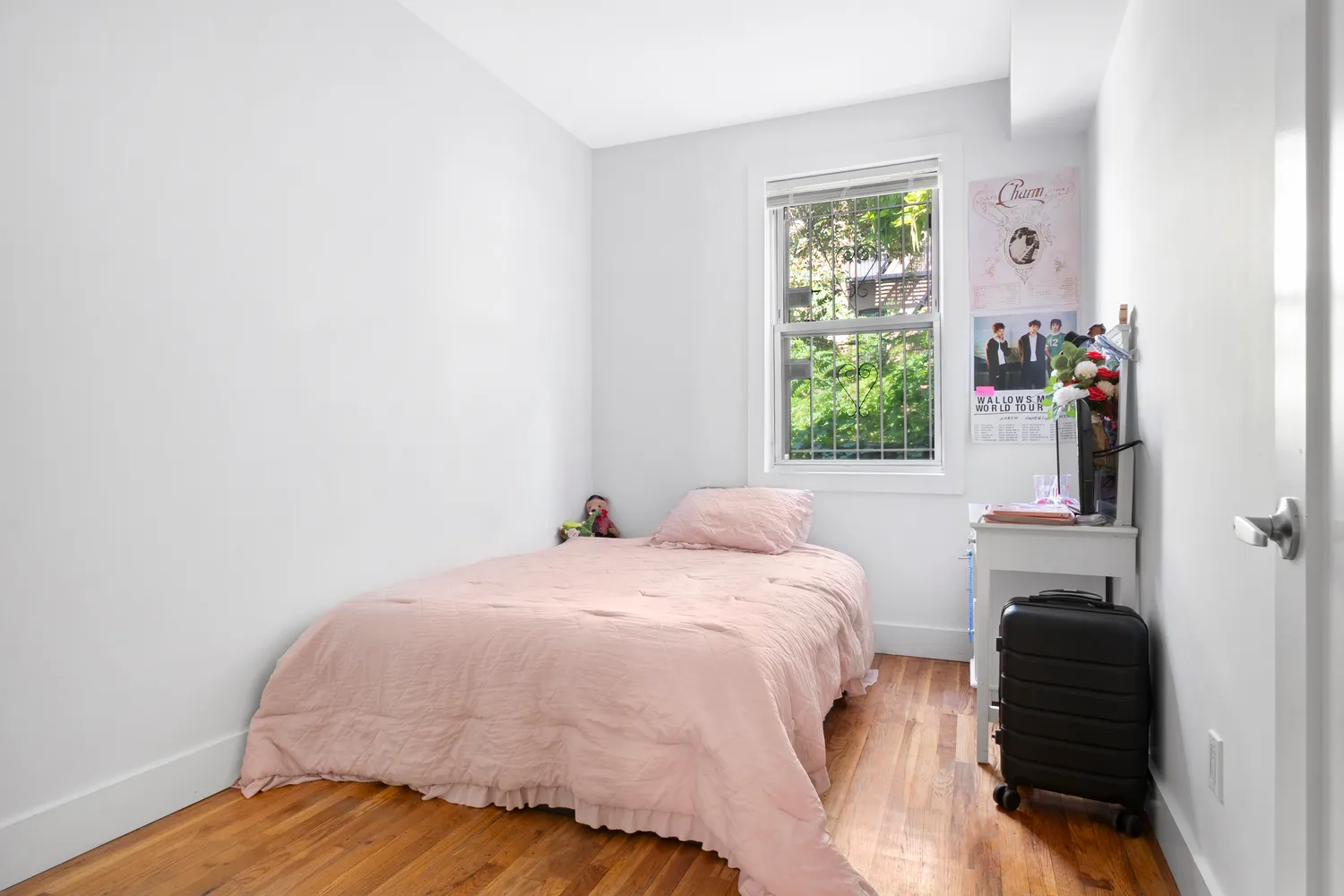 a bedroom with a bed and a window