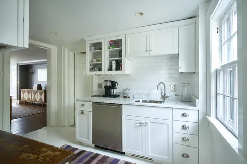 a kitchen with stainless steel appliances granite countertop a sink and cabinets