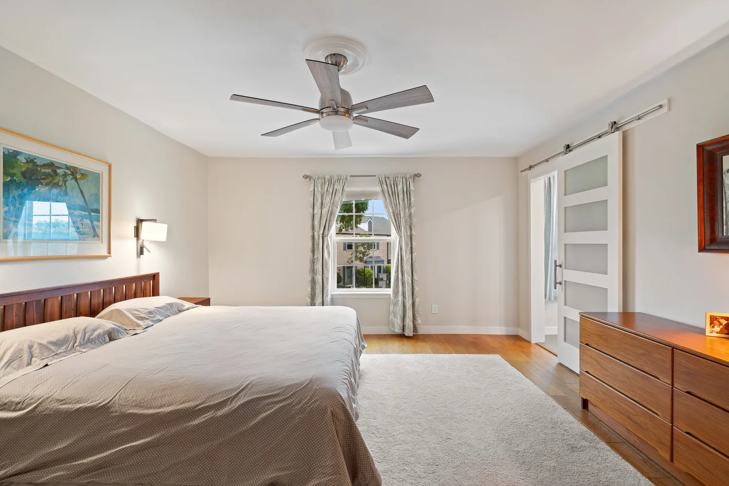 a bathroom with double vanity and mirrors