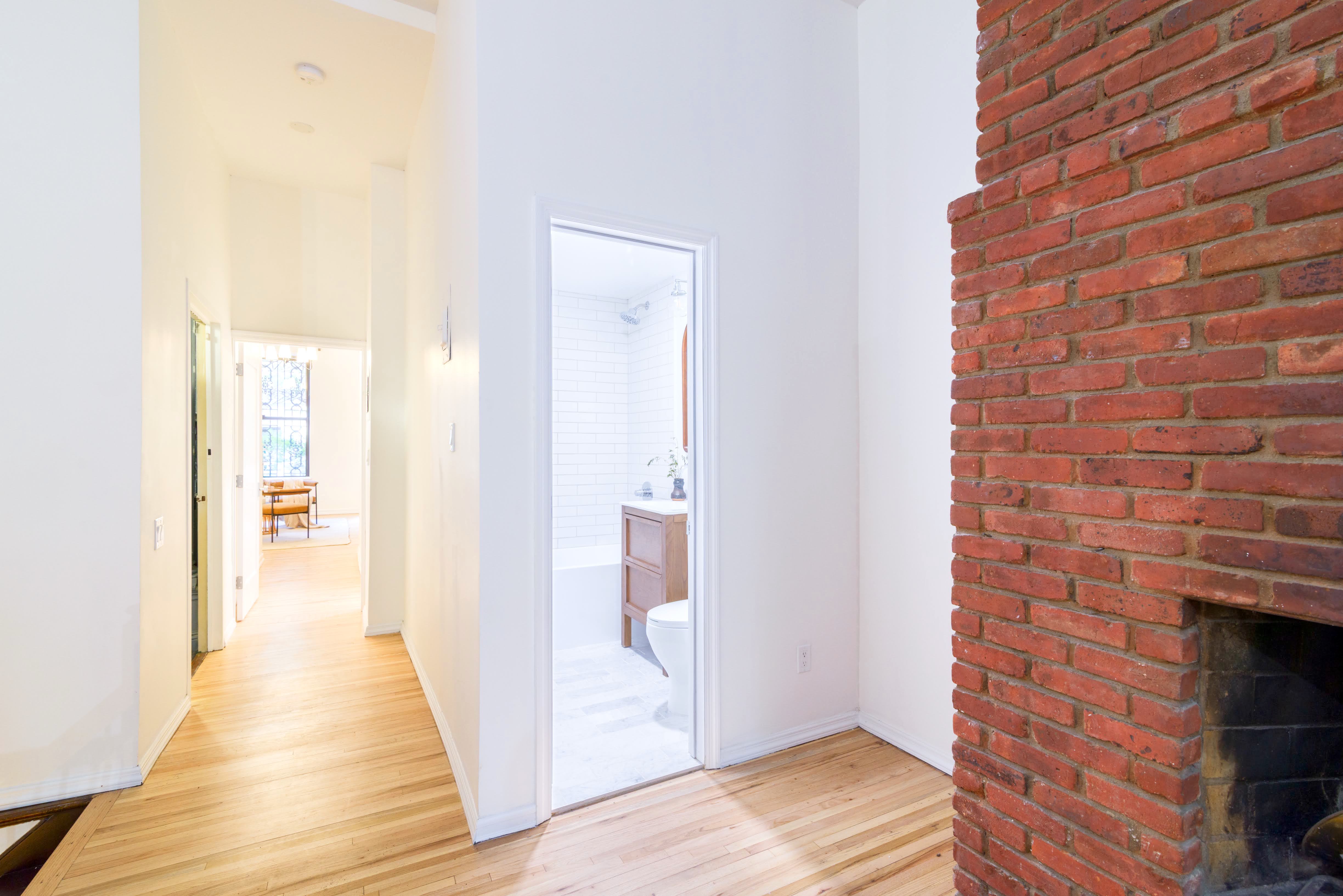 349 West 71st Street, Unit 1 Manhattan, NY 10023 - Photo 17 of 21 a view of a hallway with wooden floor and staircase