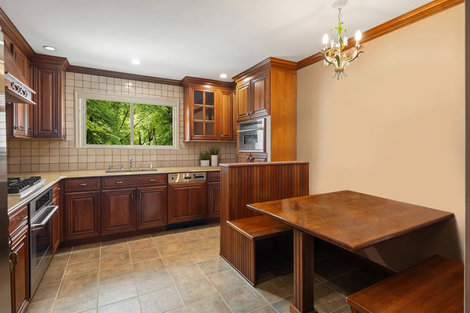 a kitchen with a stove a sink and a refrigerator