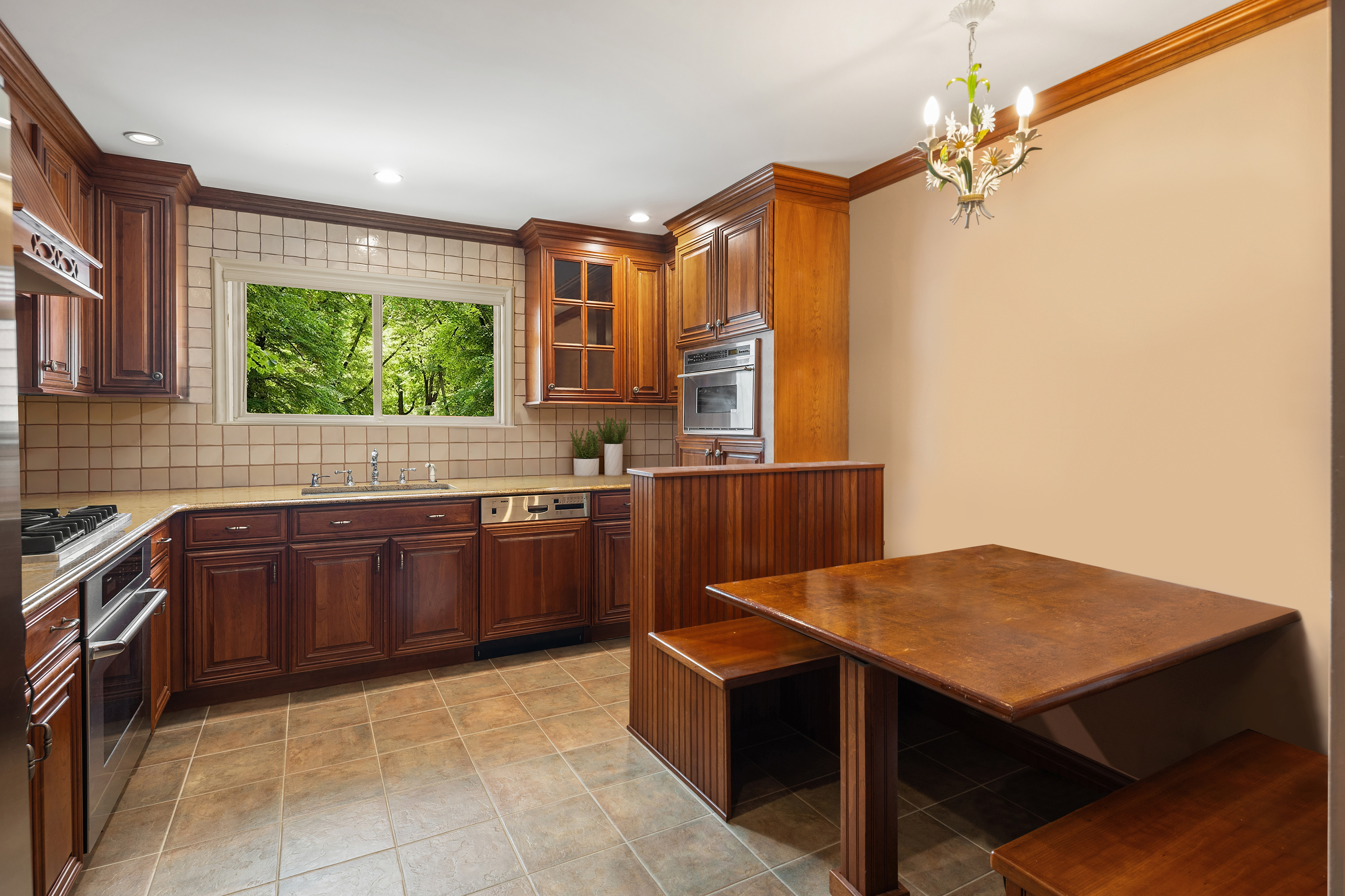 110 82nd Street Brooklyn, NY 11209 - Photo 4 of 28 a kitchen with a stove a sink and a refrigerator