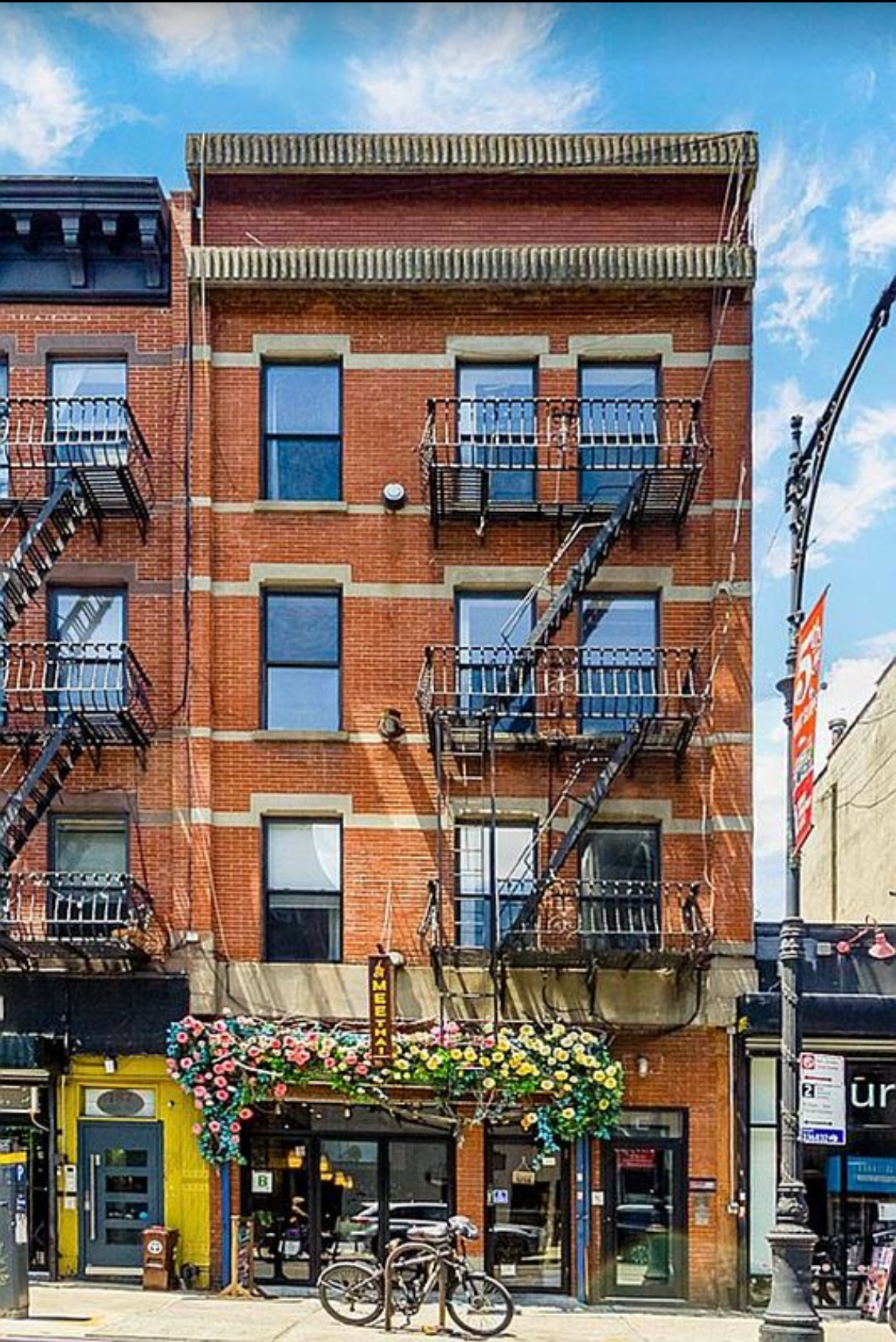 a front view of a building with retail shops