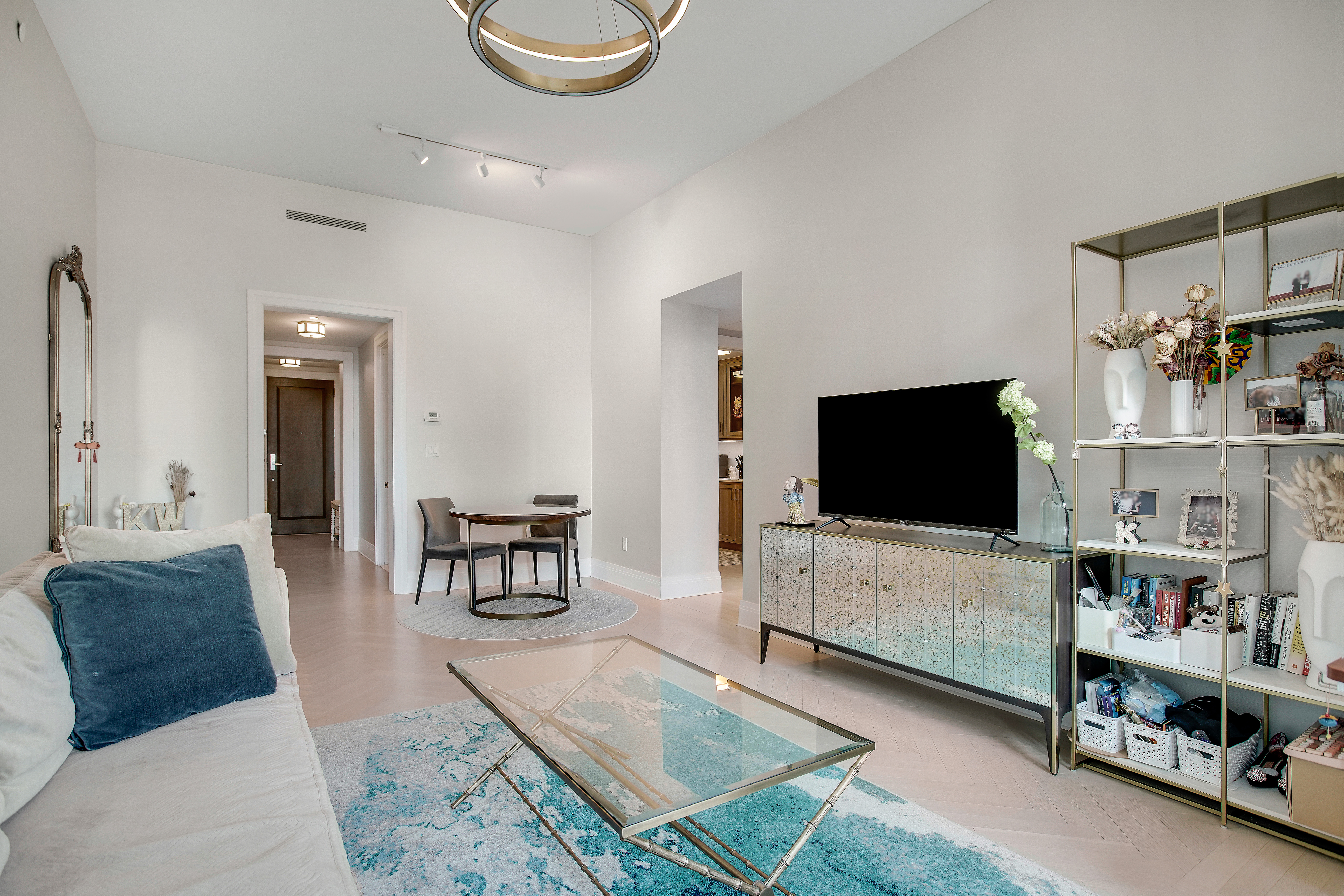 30 Park Place, Unit 46C Manhattan, NY 10007 - Photo 4 of 20 a living room with furniture and a flat screen tv