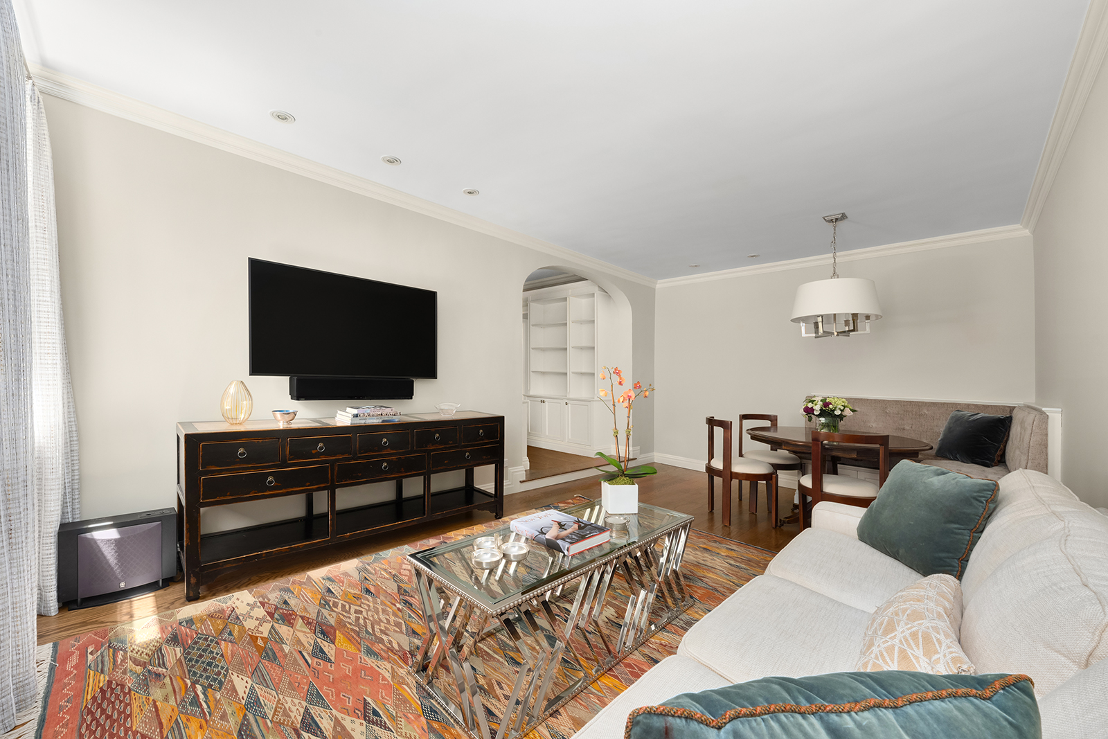 75 Bank Street, Unit 2H Manhattan, NY 10014 - Photo 3 of 18 a living room with furniture and a flat screen tv