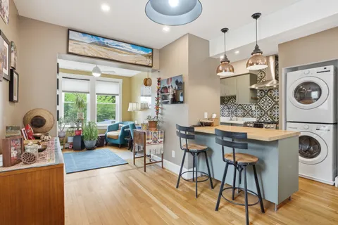 a kitchen with a sink and a stove top oven
