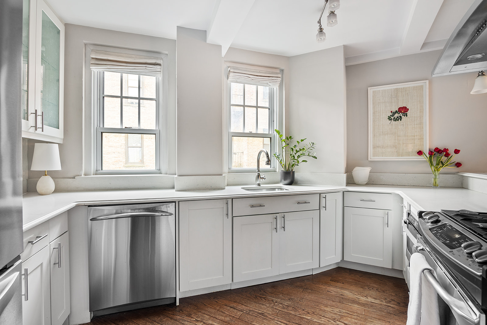 302 West 12th Street, Unit 5G Manhattan, NY 10014 - Photo 6 of 18 a kitchen with a sink stove and cabinets