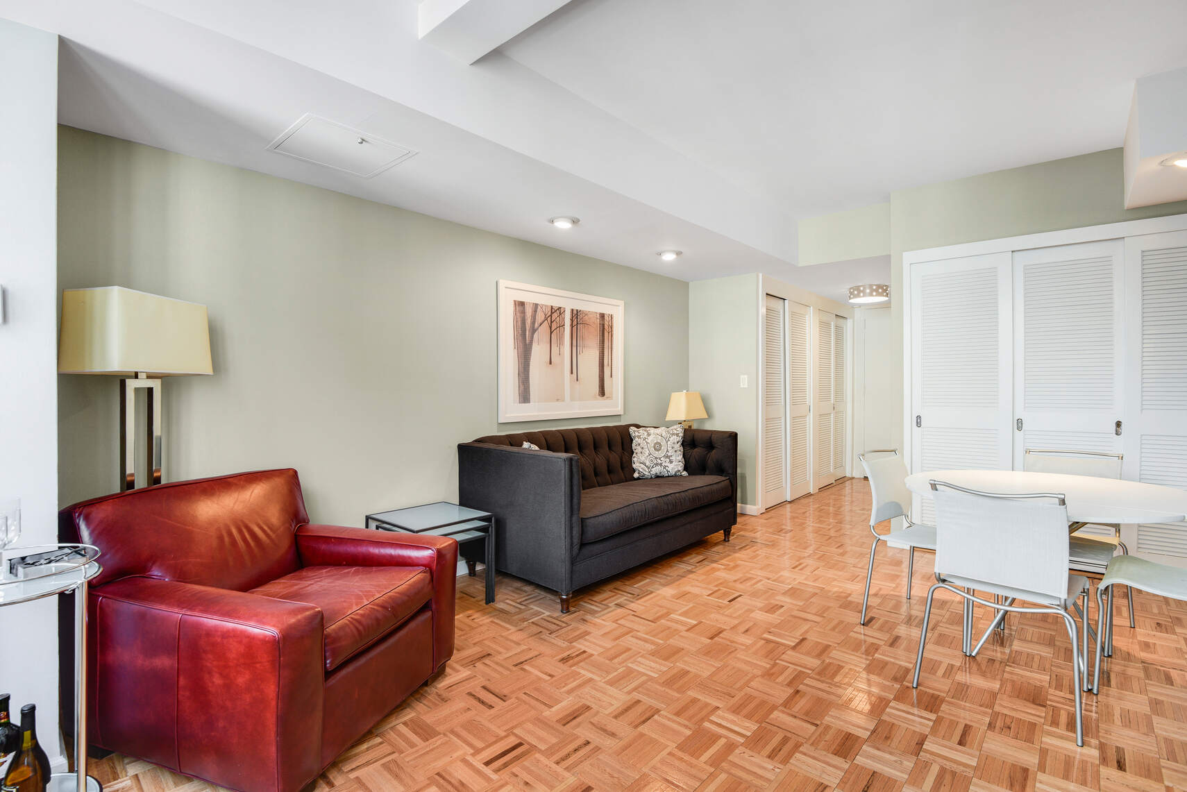 455 East 86th Street, Unit 8D Manhattan, NY 10028 - Photo 1 of 13 a living room with furniture and a table
