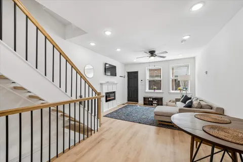a view of a livingroom with furniture window and wooden floor