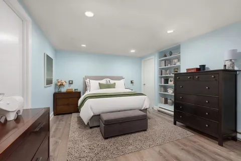 a bedroom with a bed and a closet