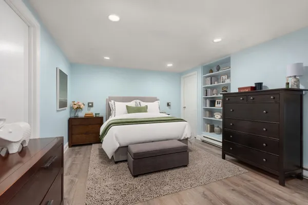 a bedroom with a bed and a closet