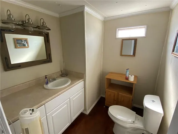 a bedroom with furniture and a book shelf
