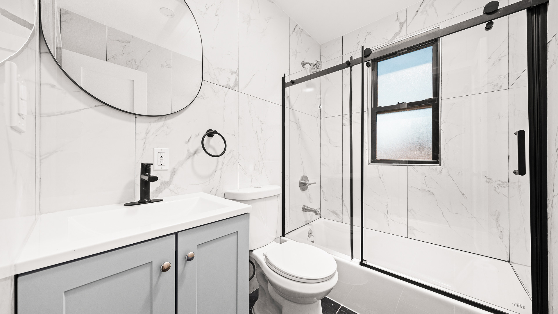 170-10 118th Avenue Queens, NY 11434 - Photo 3 of 7 a bathroom with a sink a toilet and a mirror