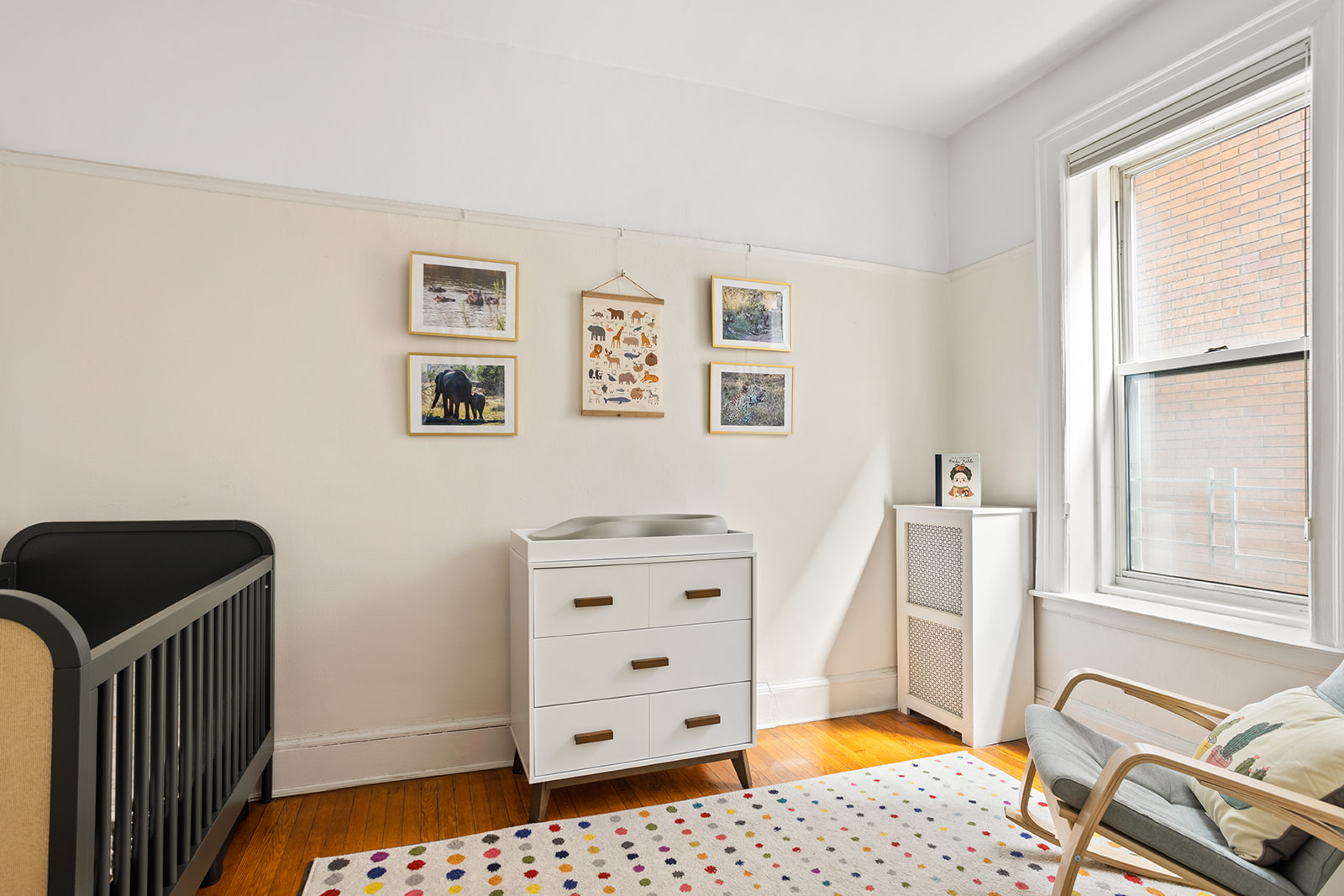 129 Columbia Heights, Unit 3 Brooklyn, NY 11201 - Photo 4 of 7 a bedroom with a bed and wooden floor
