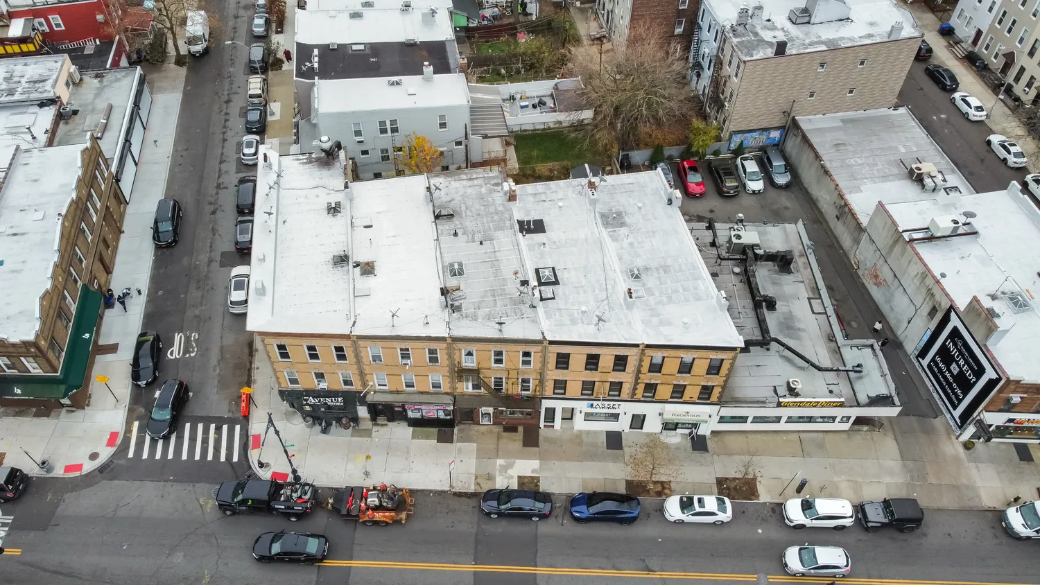 an aerial view of a city with parking