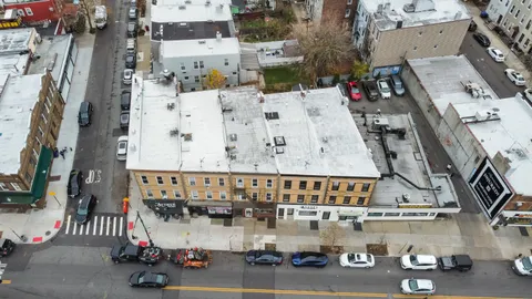 an aerial view of a city with parking