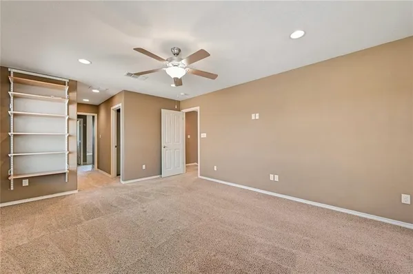 a view of an empty room with a window