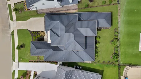 an aerial view of a house with a garden