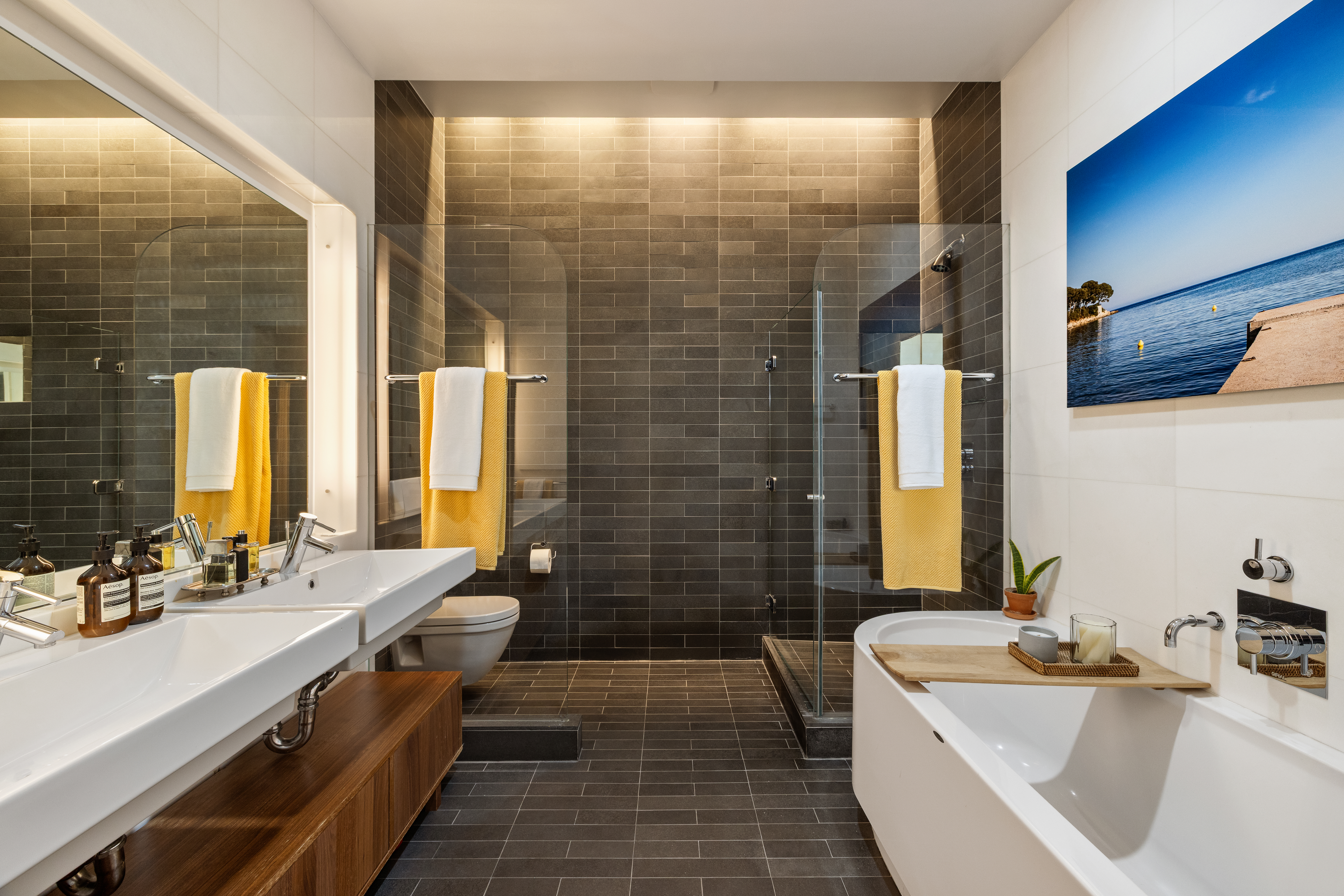 56 East 11th Street, Unit 5 Manhattan, NY 10003 - Photo 8 of 18 a bathroom with double vanity and a bathtub