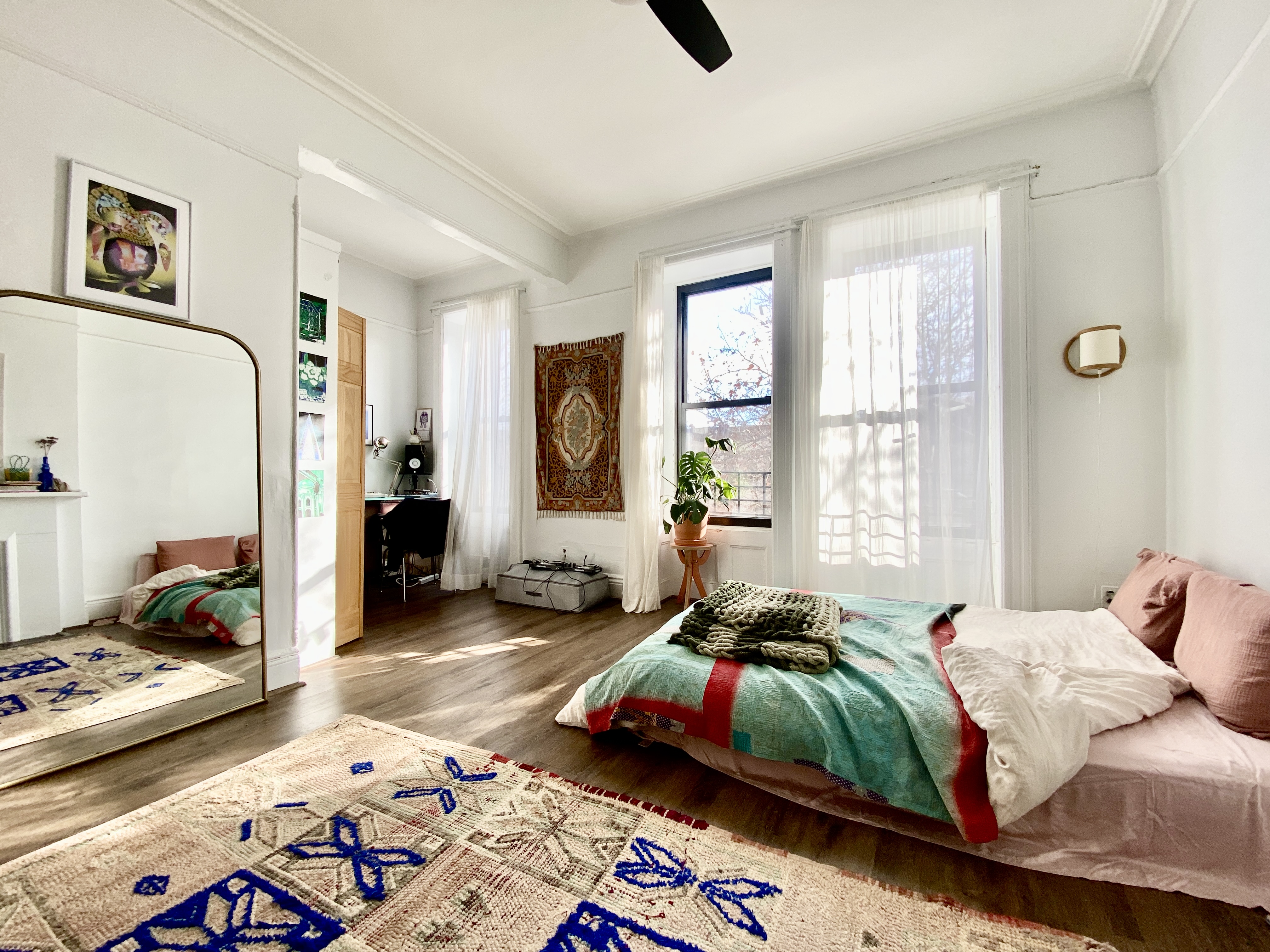 441 MacDonough Street, Unit 3 Brooklyn, NY 11233 - Photo 4 of 6 a bedroom with a bed and a couch